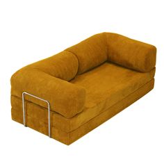 a large yellow couch sitting on top of a white floor next to a metal frame