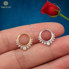 "Item Description : ✦ Gauge (Thickness) - 16 Gauge (1.2mm) ✦ Inner Diameter : 8 MM ( Will get customized according to requirement ) ✦ Metal : 14K /10K (Solid Gold) ✦ Closer : Clicker   ✦ Diamond :  Moissanite /Lab Grown / Natural / CZ ✦ Diamond Weight : 0.12 Ct ✦ White opal : 3 MM ✦ Diamond Color : G/H ✦ Diamond Clarity : VVS-VS ✦ Diamond Setting : Prong/Bezel ✦ The price indicated is the price of a single piercing. (Contact For Pair) ✦ Note : Certificate Available on request ✦ Suitable Piercings - Ear Cartilage, Nose, Ear, Daith, Helix, Septum, Lobe * This piercing is sleek and stylish. It is produced carefully to make you and your loved ones happy. Prepared with love and experience. * 100% Handmade All Products of the shop will be customized with metal purity like 10K Solid Gold, 14K Sol 14k Gold Nose Rings For Wedding, Fusion Style Promise Jewelry, Gold Halo Septum Ring For Wedding, 14k Gold Round Septum Ring For Wedding, Dainty Silver Septum Ring For Wedding, Silver Hoop Septum Ring In 14k Gold, Hoop Septum Ring With Prong Setting As Gift, 14k Gold Internally Threaded Nose Rings For Wedding, Silver 14k Gold Hoop Septum Ring