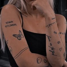 a woman with many tattoos on her arms