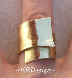 "This a solid brass, handcrafted, hammered adjustable band/ring. Whatever size you need, it can be adjusted half size up and down to wear it different fingers. The ring is about little over 1/2\" in the front between the widest part is about 1\" Really fun to wear, easy to clean and gets nicer with wear. Is for men & women. Also make them in solid brass and sterling silver . To clean, you can drop it in some lemon/water mixture for 10 min, dry, use a silver polishing cloth and you are good t Adjustable Hammered Brass Ring, Adjustable Brass Wide Band Open Ring, Hammered Brass Wide Band Jewelry, Unique Hammered Brass Rings, Handmade Adjustable Wide Band Ring For Wedding, Unique Adjustable Hammered Rings, Adjustable Metal Wide Band Ring, Hammered Ring, Piercing Shop