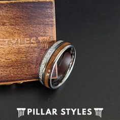 Whiskey barrel wood, meteorite, and premium tungsten carbide are cleverly crafted into a silver wedding band that's smooth as Tennessee whiskey! Salvaged small batch whiskey wood is derived from aged casks in Tennessee and has a remarkable color profile that accentuates the vibrant meteorite and polished silver finish. For the couple who desires a ring that breaks free from the mundane, this unconventional reclaimed whiskey barrel ring checks all of the boxes. This 8mm wood & simulated meteorite Whiskey Barrel Ring, Meteorite Wedding Rings, Smooth As Tennessee Whiskey, Barrel Ring, Wood Wedding Ring, Barrel Rings, Tungsten Mens Rings, Meteorite Ring, Rings Mens Wedding Bands