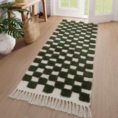 a green and white rug on the floor