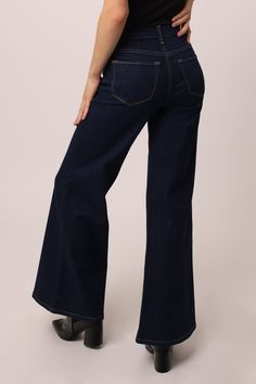 High rise wide leg jeans. It's the trusted fit that sits at natural waist and easy fitting in the hips and thigh. Full inseam on comfort stretch denim accented with tailored center inseam press & washed in original rich dark indigo shade.11 1/2" Front Rise (include waistband), 24 1/2" Leg Opening, 31" inseam (on Model size 27) 98% COTTON 2% SPANDEX Machine wash cold, Tumble dry low Imported Zip fly and button closure Five-pocket style Luxury Dark Wash Short Length Bottoms, Luxury High Waist Dark Wash Flare Jeans, Cheap High Rise Dark Wash Bottoms, Luxury Mid-rise Dark Wash Pants, Luxury Dark Wash Garment-washed Jeans, Luxury Dark Wash Garment Washed Jeans, Luxury Dark Wash Wide-leg Jeans, Luxury Dark Wash Cropped Leg Bottoms, Luxury Dark Wash Jeans With Button Closure