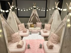 a living room filled with lots of pink furniture