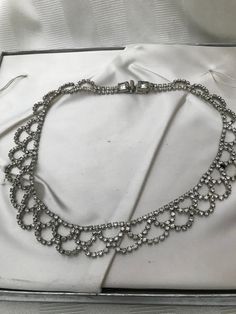 "1950's rhinestone costume jewelry. Bib style necklace in excellent vintage condition. All rhinestones are present on this piece. Lovely piece of costume jewelry for a wedding accessory. Measurements are; 16 1/2\" x 3/4\" Feel free to convo me with any further questions. Thank you for your interest." Party Bridal Necklace With 17 Jewels And Crystal, Party Crystal Diamond Necklace, Formal Diamond Rhinestone Necklace, Party Diamond Necklace With Crystal Detail, Formal Sparkling Diamond Rhinestone Necklace, Glamorous Rhinestone Necklaces For Anniversary, Sparkling Metal Rhinestone Necklace For Wedding, Evening Rhinestone Necklace With Jewels, Glamorous Diamond Rhinestone Necklace For Formal Events