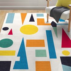 an area rug with colorful shapes on it