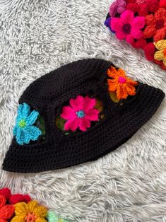 Look shagedelic in this groovy rainbow flower bucket hat🌈✨ Made with bright neon colored and black acrylic yarn. This hat fits average sized adult heads.

MEASUREMENTS

23 inches around
7 inches from crown to brim
3 inch wide flower band
1.25 inch wide brim
6.5 inches across top of hat

Hand/gentle wash and air/tumble dry for best results.
Do not bleach or iron.
Message me about custom sizing and/or colors.
Feel free to let me know your questions and concerns🌸 Groovy Rainbow, Flower Bucket Hat, Flower Rainbow, Rainbow Flower, Hat Fits, Flower Bucket, Flower Band, Rainbow Crochet, Retro Rainbow