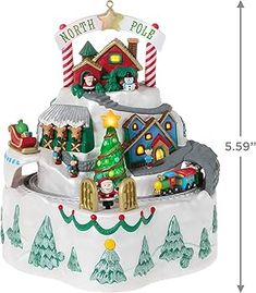 a christmas village ornament is shown on a white background