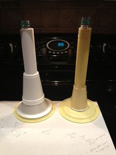 two white and yellow cones on top of a piece of paper next to an oven