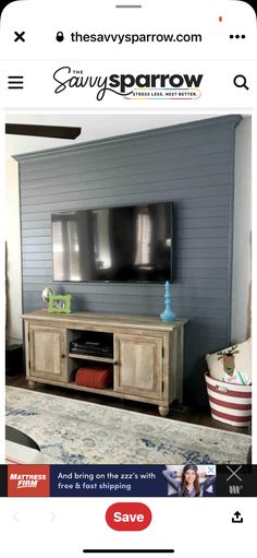 an image of a tv on the wall in a living room with blue walls and white carpet