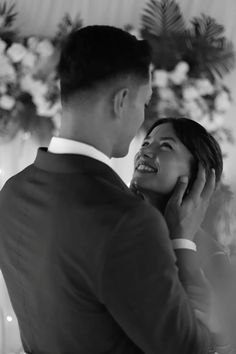 a man and woman standing next to each other