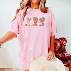 Western Cowgirl Boot Christmas t-shirt.  These tees are Comfort Colors and are made to last using premium ringspun cotton, this creates an vintage-soft shirt. The soft-washed, garment-dyed fabric brings extra coziness to your wardrobe while the relaxed fit makes it an excellent daily choice. ✦ 100% Ringspun Cotton ✦ Relaxed fit ✦ Medium fabric ✦ Sewn-in twill label ✦ Eco-friendly, Ethically Made & Sweatshop Free ✦ Printed to order with non-toxic ink ✦ Durable and Long-lasting ✦ Shirts are pre-sh Washing And Drying Machine, Photo Care, The Only Exception, Cowgirl Boot, Cowboy Christmas, Boots Cowboy, Western Christmas, Vintage Soft, Western Cowgirl