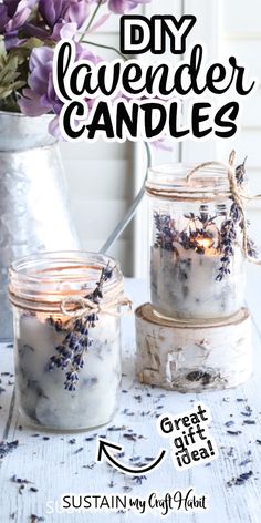 two jars filled with lavender candles sitting on top of a table