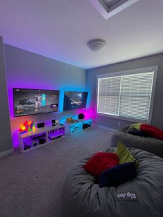 a living room with two couches and a flat screen tv on the wall in it