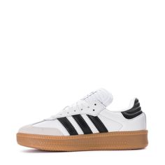 The Samba started as an indoor soccer trainer, but for over 70 years, it's been a staple off the field. The adidas Samba XLG youth shoes bring a fresh twist to the classic with an oversized design and a mix of leather and suede. The timeless colors keep the style effortlessly simple. Pair them with baggy jeans and a graphic tee for a casual day out or with wide-leg pants and your favorite bucket hat for a go-to look.Features: Classic lace closure. Woven "adidas SAMBA" tongue label. Printed "SAMB Adidas Low-top Basketball Shoes With Gum Sole, Adidas Skate Shoes With Gum Sole For Sports, Soccer Trainer, Kicks Shoes, White Kicks, Adidas Tee, Indoor Soccer, Youth Shoes, Backpack Sport