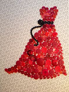 a red dress made out of buttons