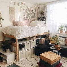 a bedroom with a loft bed and lots of storage space in the middle of it