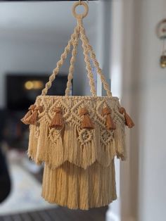 a macrame bag hanging from a hook