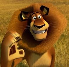 an animated lion holding a toothbrush in his hand and standing in the grass with another animal behind him