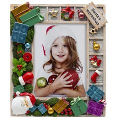 a photo frame with christmas decorations and ornaments around it, as well as an ornament