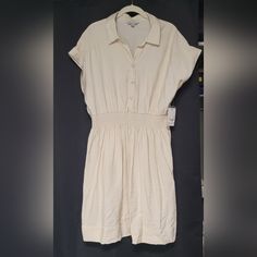 Lightweight Rayon/Nylon Blend. Cream Color, Short Sleeved, Collared V-Neck, 3 Button Front, Thick Elastic Waist, & Tailored Back. Nice Texture, Comfortable & Flowy. Women's Size Xl, Approximately 27" Sleeve To Sleeve 24" Waist To Hem **Per Poshmark Guidelines, No Returns For Fit Issues. Please Note All Measurements Are Approximate. V-neck Rayon Shirt Dress For Daywear, Spring V-neck Rayon Shirt Dress, Fitted Collared Rayon Dress, Collared Rayon Dress For Day Out, Casual Dresses With Buttons And Collared Neckline, Casual Dress With Buttons And Collared Neckline, Casual Collared Rayon Dress, Casual Beige Rayon Dress, Casual Collared Neckline Dress With Relaxed Fit