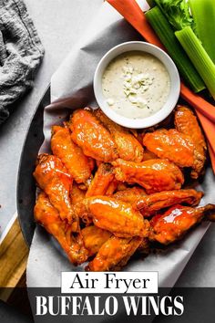 chicken wings and celery with ranch dressing on the side