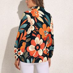 Immerse yourself in the timeless allure of the '70s with our Vintage-inspired Black Orange Floral Blouse, a stunning piece that captures the essence of the era. Embrace the free-spirited vibes with our 70s Style Blouse, perfect for the modern woman who appreciates the classic charm of '70s Clothing. This Boho Style Top is an inspired choice, featuring a bold and beautiful large floral pattern print in orange, beige, and black, making it a versatile and eye-catching addition to your wardrobe.Indulge in the whimsical elegance of this semi-sheer top, adorned with long balloon sleeves and elastic cuffs, adding a touch of grace and playfulness to your ensemble. Whether it's a casual evening or a formal event, this Floral Top seamlessly transitions between occasions, offering a perfect blend of Spring Long Sleeve Tops With Bold Print, Retro Print Long Sleeve Blouse For Spring, 70s Inspired Multicolor Tops For Spring, Fitted Long Sleeve Blouse With Bold Print, Retro V-neck Blouse For Fall, Casual Blouse With Retro Print, Multicolor Retro Blouse With Retro Print, Retro Black Blouse For Fall, Trendy Multicolor Blouse With Retro Print