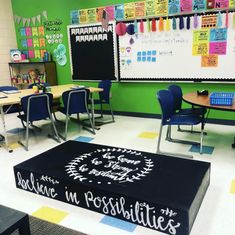 a classroom with desks, chairs and a blackboard