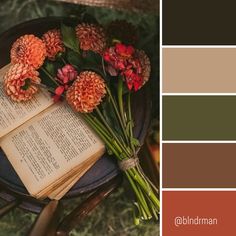 an open book sitting on top of a chair next to flowers and a bouquet of dahlias