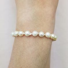 This is a charming baroque style bracelet made of 22 Japanese Cultured Seawater pearls. The pearls are slightly irregular and measure about 6mm each.   - The magnetic clasp is gold plated - 7.5" bracelet Formal Baroque Pearl Drop Bracelet, White Baroque Pearl Bracelets For Formal Occasions, Elegant Single Strand Baroque Pearl Bracelet, Formal White Baroque Pearl Bracelets, Pearl White Akoya Pearl Bracelet With Pearl Drop, Single Strand Akoya Pearl Bracelet In Pearl White, Elegant Single Strand Baroque Pearl Bracelets, Single Strand Pearl Bracelet, Classic Pearl Bracelet With Oyster Style