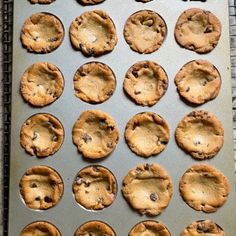 a pan filled with cookies on top of a table