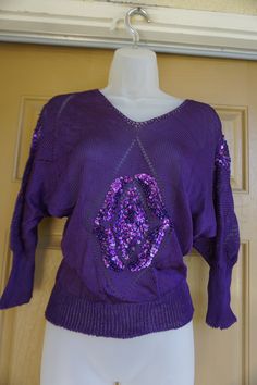 "Vintage purple knit sweater with sequins. Size small. In good vintage condition. Measurements taken across front laid flat 19\" across front armpit to armpit 13\" across front of waist (stretches to 19\") 22\" length" Retro Purple Winter Sweater, Retro Purple Long Sleeve Sweater, 90s Purple Winter Sweater, 1980s Knitwear, Vintage Multicolor Acrylic Sweater, Christmas Sweaters, Knitted Sweaters, Sweaters For Women, Crop Tops