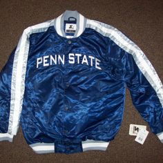 New W Tags Penn State Nittany Lions Starter Jacket. High Quality Polyester Satin Jacket With A Snap Up Front And Ribbed Knitted Cuffs, Collar And Waist Band. The Jacket Has A Polyester Outer Shell And The Inside Lining Is Soft Polyester. The Penn State Lettering Nittany Lions Lettering Meticulously Sewn On. New Starter 2019. Color: Blue With Silver Sewn On Lettering And Silver & White Trim. Satisfaction Guaranteed Or Return. Measurements: M: 24" L: 25" Xl 26" 2x: 28" Across Chest. Sporty Silver Long Sleeve Outerwear, Penn State Sweatshirt, Penn State Tailgate, Old Main Penn State, Blue Half-zip Sports Outerwear, Vintage Penn State Sweatshirt, Nittany Lion, Satin Jackets, Penn State