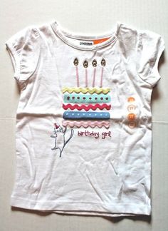 Gymboree Birthday Girl Tee Toddler Girl Size 2T Fits 30-33 lbs., 33-36 in. height White cotton knit shirt with a birthday cake sewn on the front and the words "Birthday Girl" stitched underneath it. The candles have gold gems for the flames. Some of the layers of the cake are yellow, red, or pink rick-rack. So cute! Brand New with Tags! Girls Cake, Girl Cake, Rick Rack, Girls Tees, Knit Shirt, Birthday Girl, Cotton Knit, Shirt Top, White Cotton