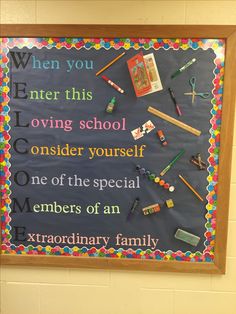 a bulletin board with writing and school supplies on it in front of a classroom wall