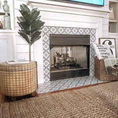 a living room with a fire place and rugs