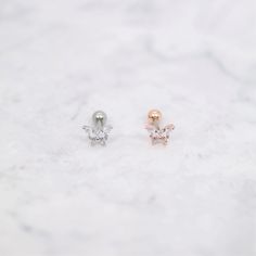 ⇢⇢ PLEASE READ BEFORE PURCHASING ⇠⇠ ✧✧ This listing is for ONE piece only ✧✧ PLEASE BE AWARE of your own ear piercing size!! Everyone has different sizes and shaped ears, with different gauge sizes, so our suggestion may NOT be for everyone. 💜 Item Details 💜 ✧ Thickness: 16 Gauge (1.2mm) ✧ Top Size: 7mm x 6mm ✧ Externally Threaded ✧ For: Cartilage, Tragus, Helix, Conch ✧ Colors: Rose Gold / Silver ✧ Ball Back (4mm) ✧ 1 Piece ✧ If you wanted a 3mm ball end (Silver color only), please leave me a Rose Gold Drop Cartilage Earrings Single Earring, Rose Gold Drop Cartilage Earring, Rose Gold Pierced Ear Cuff As Gift, Rose Gold Single Earring Ear Cuff As Gift, Delicate Rose Gold Single Cartilage Earring, Rose Gold Single Ear Cuff As Gift, Rose Gold Single Cartilage Earring For Wedding, Delicate Rose Gold Piercings For Gift, Rose Gold Internally Threaded Cartilage Earrings As Gift