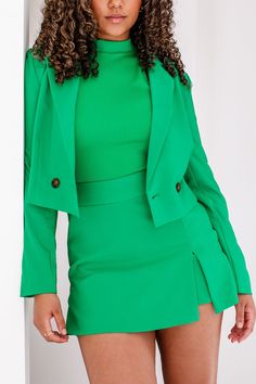 In our power-dressing era! The Wren Kelly Green Crop Blazer features a green fabric, a collared neckline with notched lapels, two front darts, 3 back darts, 2 front buttons with a closure, and a cropped fit. Style this blazer with our Wren Skort to complete the look! Green Crop Blazer, Cropped Blazer Outfit, Crop Blazer, Power Dressing, Cropped Blazer, Blazer Outfits, Wren, Fit Style, Kelly Green