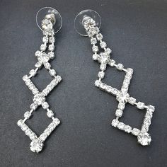 Chandelier Earrings Dangle Cz Crystal Rhinestone Diamond Earrings Dangle Drop Earrings With Clear Crystals Or Cz. Nwt New With Tags. Lots Of Sparkle Bright Geometric Triangle Drop Earrings Connected Like Chains In Diamond Shapes Are Very Art Deco Or Art Neauvous. Set In Silver Toned Metal That Allows Alot Of Movement. These Are So Bright And Shiny. Great For Evening, Dress Up Or For The Gram. Good New Condition. Measurements To Follow. White Crystal Diamond Earrings For Party, White Chandelier Earrings With Diamond Accents For Party, Diamond White Chandelier Earrings With Diamond Accents For Party, White Diamond Chandelier Earrings For Party, Dazzling Diamond White Dangle Crystal Earrings, Diamond White Chandelier Earrings With Sparkling Stones For Evening, Diamond White Dangle Earrings For Party, Crystal Chandelier Earrings With Diamond Accents, Diamond White Dangle Crystal Earrings With Rhinestones