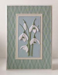 a card with some white flowers on it