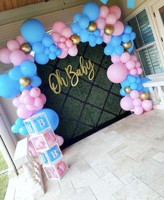 a baby's first birthday party with balloons and decorations