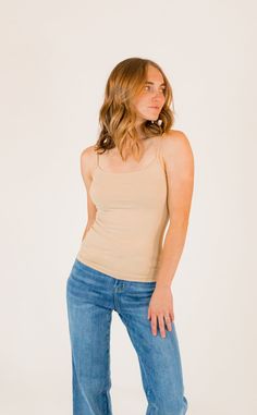 + neutral tan+ four way stretchy+ subtle round neckline+ buttery soft - 92% nylon 8% spandex+ stretchy & holds shape well *fits sizes 0-10 Supportive Solid Tops For Spring, Everyday Fitted Seamless Tank Top, Fitted Cream Tank Top With Built-in Bra, Stretch Soft Touch Camisole Top, Stretch Camisole Top With Soft Touch, Full Coverage Fitted Top With Soft Touch, Fitted Camisole Tops With Soft Touch, Supportive Tops For Everyday Summer Wear, Fitted Full Coverage Top With Soft Touch