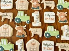 decorated cookies with farm animals, tractors and words that say i'm one on them