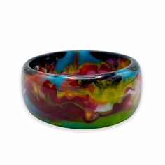 Chunky bangle bracelet with colorful marbled design 2.5"D Made from colored resin Note: Each piece is handmade and one-of-a-kind. Patterns and coloring will vary Free shipping! Designed in South Florida and made in Brazil. Multicolor Bangle Bracelets In Wearable Art Style, Multicolor Hand Painted Bangle Jewelry, Hand Painted Multicolor Bangle Jewelry, Multicolor Wearable Art Bangle Bracelets, Handmade Multicolor Resin Bracelets, Multicolor Hand Painted Bangle, Hand Painted Multicolor Bangle, Multicolor Hand Painted Bangle Bracelets, Multicolor Hand Painted Bangle Bracelet