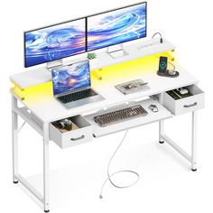 two computer monitors sitting on top of a white desk