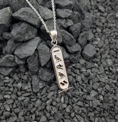 Personalized Cartouche Pendant Name Necklace, Your Name into Ancient Egyptian Hieroglyphic language, Cartouche Jewelry.This Cartouche will carry your name Converted into the Ancient Egyptian language, in the Hieroglyphic characters up to 12 characters, fit short and long names.The Cartouche has a modern ageless look eye-catcher. A perfect gift fit everyone and any occasion.• Material: Our Cartouche necklace is handcrafted using premium grade Sterling Silver.• Size: Cartouche pendant measures app Symbolic Silver Jewelry With Name Detail, Symbolic Silver Jewelry With Name, Personalized Symbolic Silver Jewelry, Symbolic Engraved Rectangular Pendant Necklaces, Symbolic Engraved Rectangular Pendant Necklace, Silver Rectangular Pendant Jewelry With Name, Egyptian Language, Cartouche Necklace, Egyptian Hieroglyphics Symbols