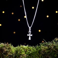 "- Size: 19mm Long, 8mm Wide (TINY - Material: Hand Cast Solid Sterling Silver .925 - One-Sided: Small .925 Stamp on the Back - Sterling Silver 4mm Jump Ring - Sterling Silver Chains are Optional - Production Time: Ships in 1 Business Day - Comes in a Small Box with a Bow, Ready for Gift Giving About the (optional) chains: ❤ 1.5mm Cable Chain: This is the lightest chain we offer and is best for single, small charms or pendants. Because they are small and light this is a great comfortable chain f Symbolic White Gold Cross Pendant Jewelry, Nickel-free Sterling Silver Cross Pendant Jewelry, Sterling Silver Cross Necklace Hallmarked, Sterling Silver Cross Necklace, Hallmarked, Nickel-free Ankh Shaped Elegant Jewelry, Symbolic Sterling Silver Cross Necklace, Nickel-free Ankh Jewelry, Nickel-free Ankh Elegant Jewelry, Symbolic Cross Jewelry For Jewelry Making