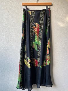 Amazing Butterfly Print  100% Silk  Black with bold green, magenta, yellow  Sheer black panels Bias cut, makes skirt slightly stretchy  Slip on with stretchy waistband  Size on tag Small  Waist 26" (unstretched) Length 36" *FOLLOW US ON INSTAGRAM!* @ventana_thirteen_vintage Thank you for visiting :) **PLEASE NOTE** vintage items are pre-owned and not new.  ~all items are final sale if you're in doubt, please ask for measurements or information. although i try to reflect colors accurately, there Black Silk Maxi Skirt For Spring, Black Silk Skirt For Summer, Printed Silk Skirt, Black Panels, Silk Skirt, Small Waist, Butterfly Print, Silk Printing, Final Sale