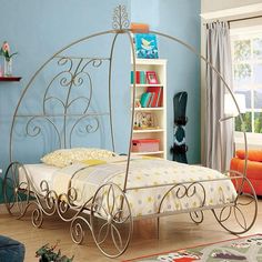 Enchant Twin Bed in Champagne. This beautiful coach design bed is filled with fun surprises! With its intricate, scrollwork pattern and its gorgeous color, our beautiful bed is more than worthy of a curtain call. Princess Transformation, Princess Carriage Bed, Unusual Beds, Carriage Bed, Twin Canopy Bed, Princess Canopy Bed, Princess Canopy, Metal Canopy Bed, Royal Bedroom