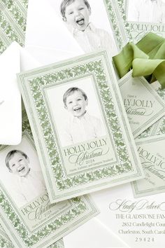 some green and white folded cards with the words holly jolly on them are laying next to each other